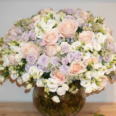 Luxury hand-tied bouquet featuring roses, spray roses, lisianthus, and garden roses in soft pastel tones – The Rochet Bouquet by Bernard Rochet London.
