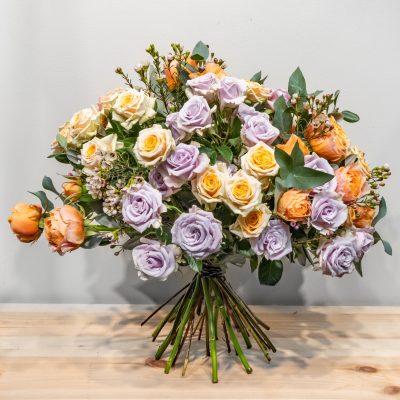 Pastel spray rose bouquet in soft peach, lavender, and blush tones – Bernard Rochet Chelsea