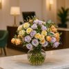 Pastel spray rose bouquet in vase on reception counter – Bernard Rochet Chelsea