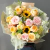 Yellow and pink bouquet with sunflowers, garden roses, spray roses and seasonal fillers – bright and cheerful summer floral arrangement.