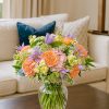 Spring flower bouquet with roses, clematis, and wildflowers in a vase – London flower delivery