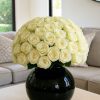 50 white roses arrangement in black vase – Bernard Rochet London