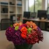Luxury warm-tone flower arrangement in low vase – Bernard Rochet London